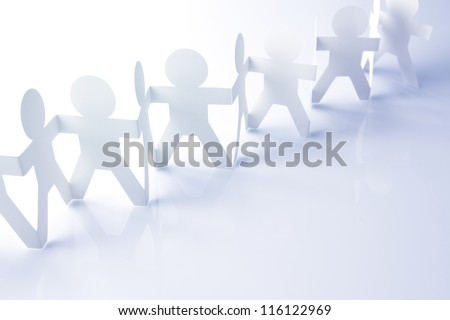 Team of paper chain people holding hands
