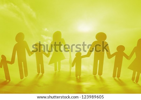 Family holding hands on yellow background