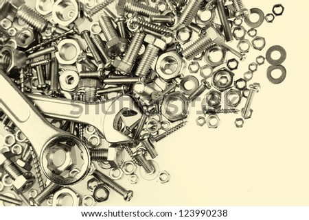 Two spanners on nuts and bolts