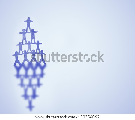 Human team pyramid on blue background