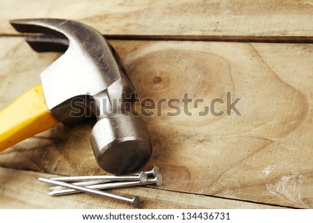 Hammer and nails on wood