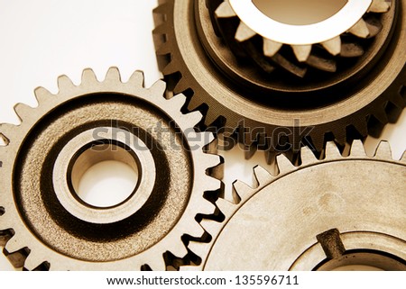 Closeup of three metal cog gears