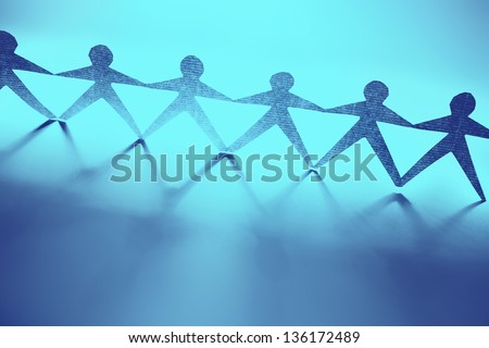 Paper doll people holding hands