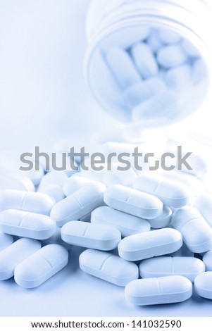 Pile of pills, blank copy space to side