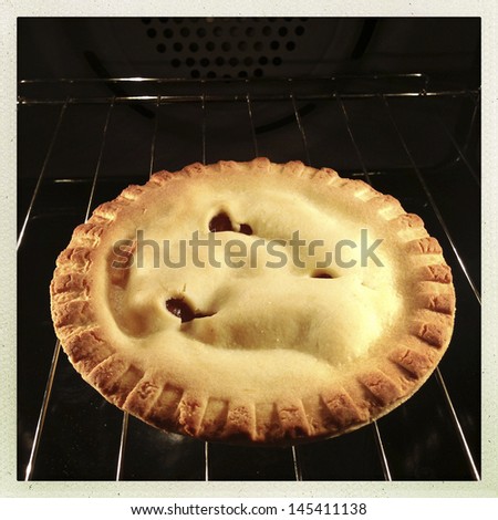 Apple pie on oven rack