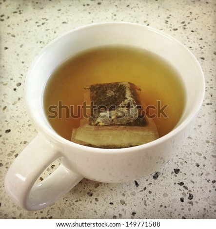 A tea bag in cup