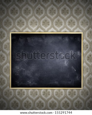 Blank blackboard on wallpaper wall