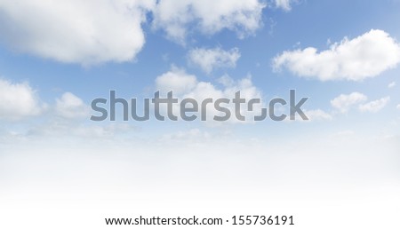 White clouds in blue sky. Large hi-res file. Advertising copy space below