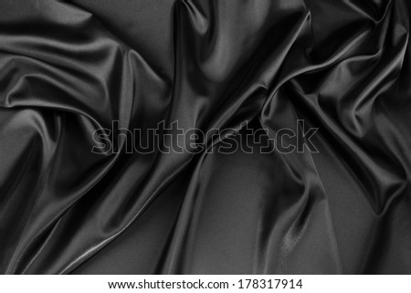 Closeup of rippled black silk fabric