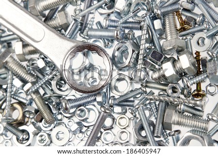 Steel wrench on nuts and bolts