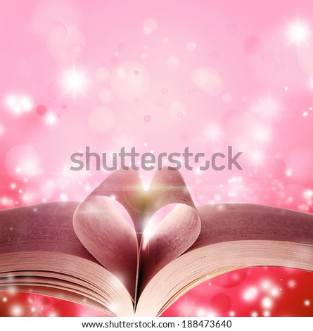Pages of book in shape of love heart in front of magical background