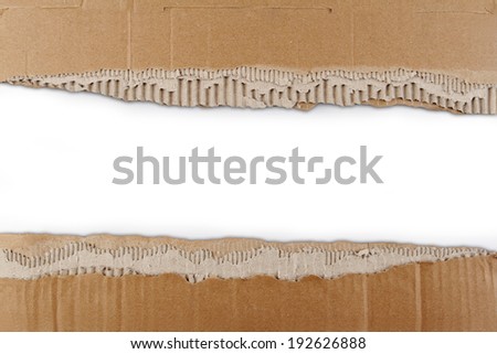 Hole ripped in corrugated cardboard