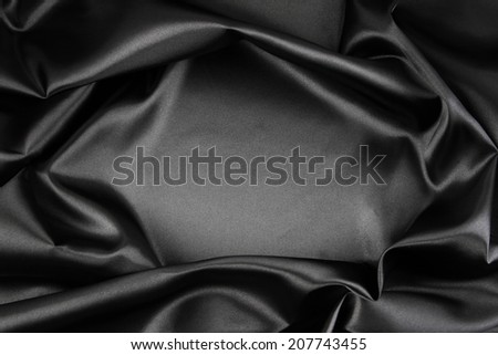 Closeup of rippled black silk fabric