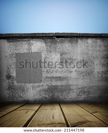 Wooden floorboards and stone wall