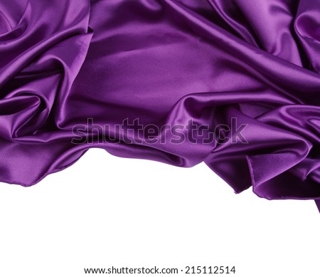 Closeup of purple silk fabric on plain background