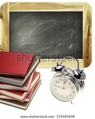 Books, clock and blackboard on plain background