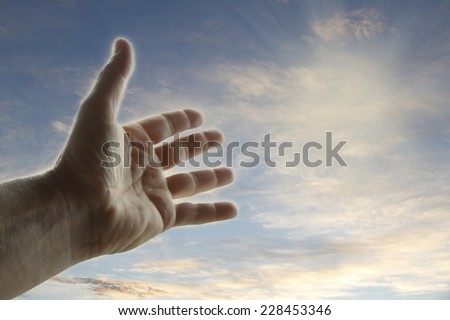Hand reaching for the sky