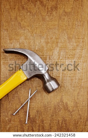 Hammer and nails on wood