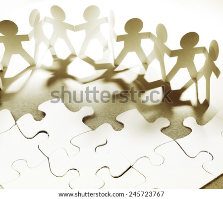 Group of people and jigsaw puzzle pieces