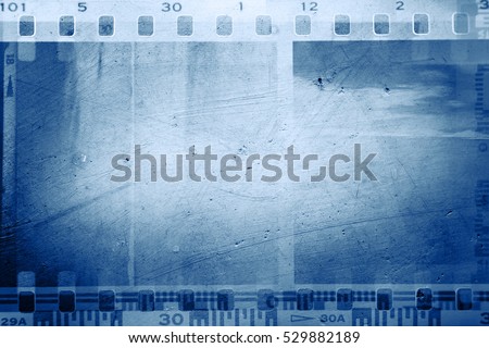 Film negative frames on blue background