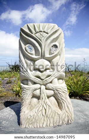 stock photo Rising Sun Tawhiri Maori God of Wind and Storm Raglan
