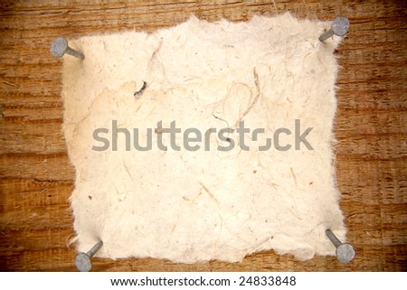 Piece of paper nailed to wall