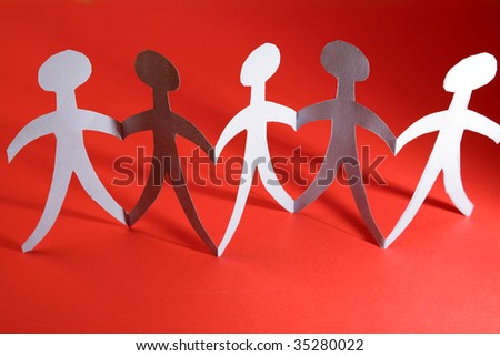 Paper-chain people on red background