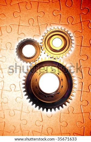 Three gears and jigsaw puzzle