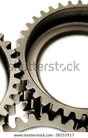 Close-up of three gears on white