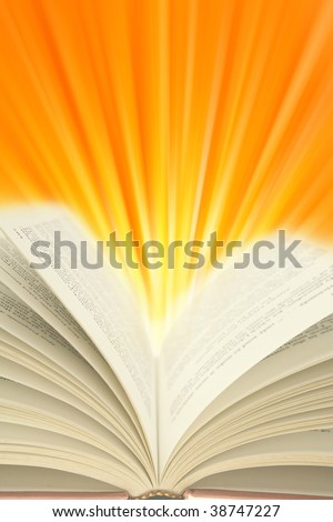 Open book and light rays. Copy space