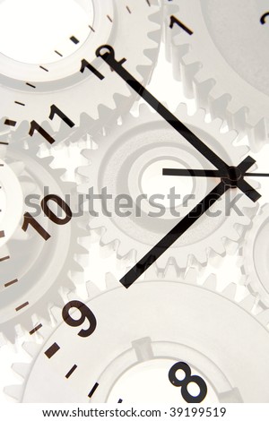 Hands on clock pointing to nine o\'clock over gears.