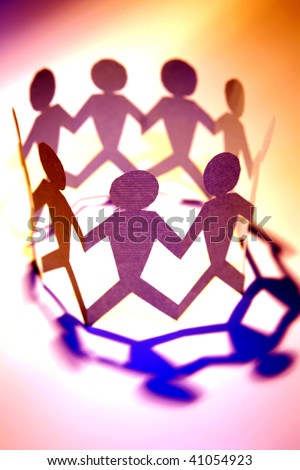 Paper doll people holding hands in a circle.