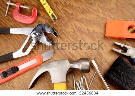 Work tools on wooden surface