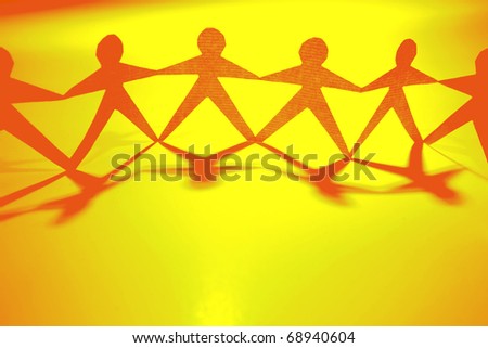 Paper doll people holding hands