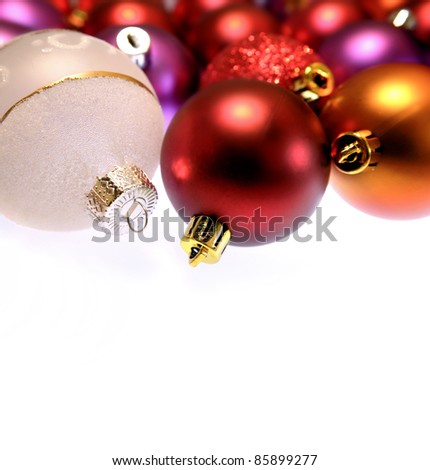 Closeup of Christmas baubles on plain background