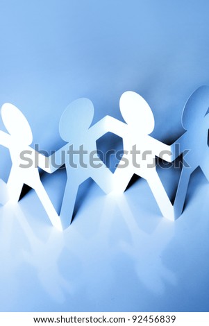 Paper chain people holding hands