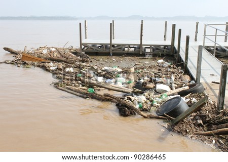 Trash floating in river - Polluted River