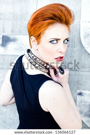 Girl with red hair, female fighter, preparing to fight