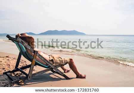 Man relaxing on deckchair