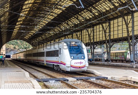 PORTBOU, SPAIN - NOWEMBER 09: High-speed Renfe train on November 09, 2013 in Portbou station. It is a border railway station where a change from Iberian gauge to standard gauge occures.