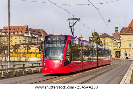 BERN, SWITZERLAND - FEBRUARY 15: Siemens Combino tram on Kirchenfeldbrucke in Bern on February 15, 2015. There are 36 trams of this class in Bern