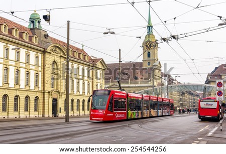 BERN, SWITZERLAND - FEBRUARY 15: Siemens Combino tram on Bubenbergplatz in Bern on February 15, 2015. There are 36 trams of this class in Bern