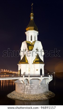 The orthodox church on the water at night