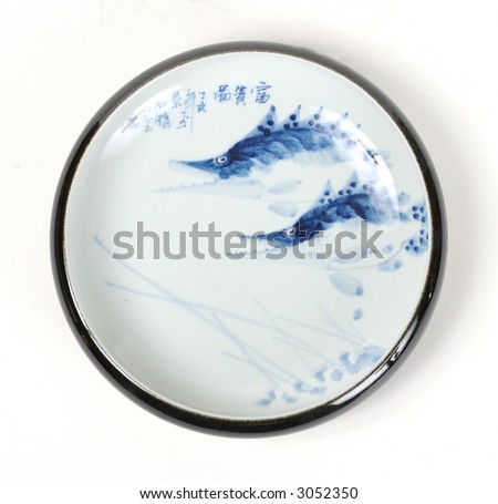 Round Chinese plate with a painting and writing in the center and a black rim