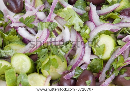 Salad of warm organic baby zucchini (courgettes), kalamata olives, organic spanish onion, organic flat leaf parsley, baby capers, lemon juice and olive oil