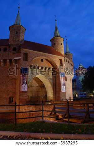 A gate to Krakow - the best preserved barbican in Europe and Florianska Gate, Poland by night