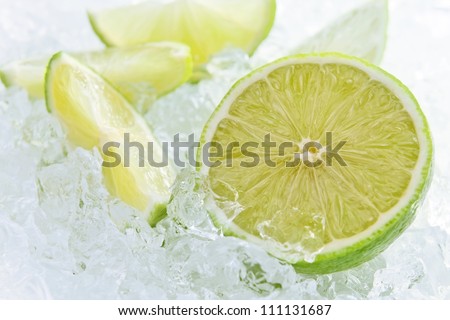 lime pieces mixed with ice, focus on a center.