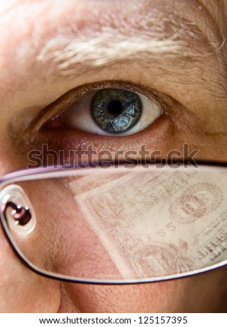 Eye of the businessman, natural reflexion in eyes and glasses