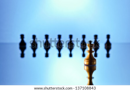 chess on a mirror table , focus on a foreground
