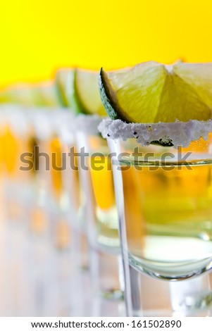 tequila , lime and salt , macro shot , focus on foreground
